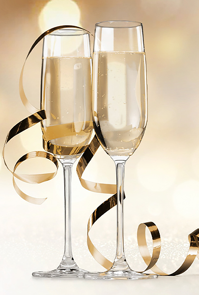 NYE champagne glasses with gold ribbon