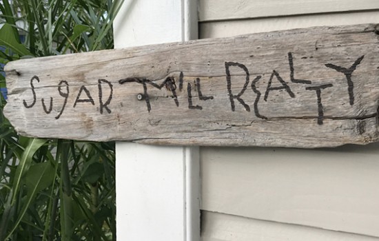 A piece of wood with the brand name written on it.