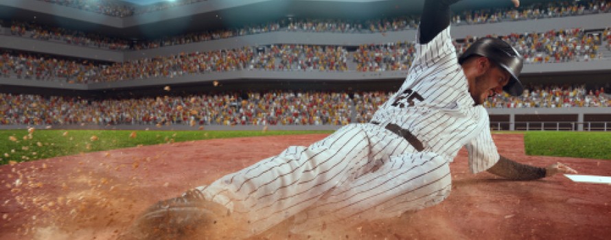 baseball player sliding onto base
