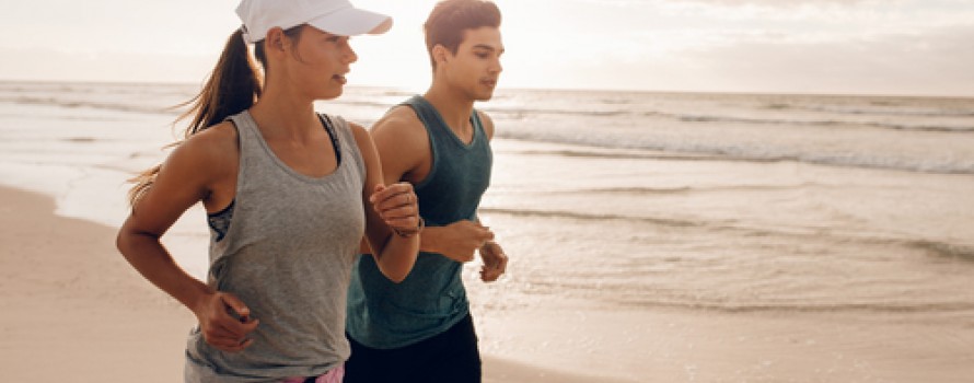 couple running on beach