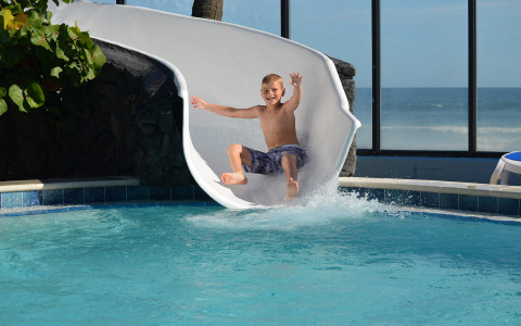  child going down waterslide 