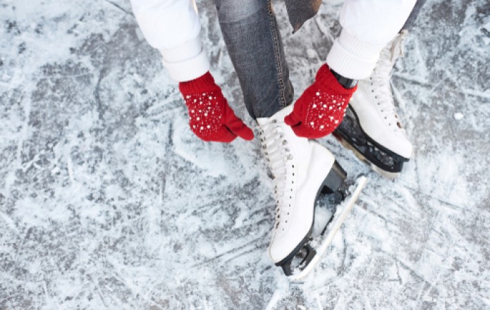 girl tying her ice skates
