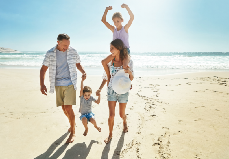 family together on the beach