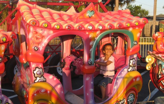 child having fun on a festival ride