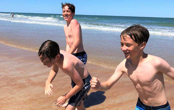kids running on beach