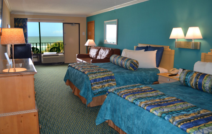 Oceanfront Room - Plan 8-Guest room with two queen beds with blue covers