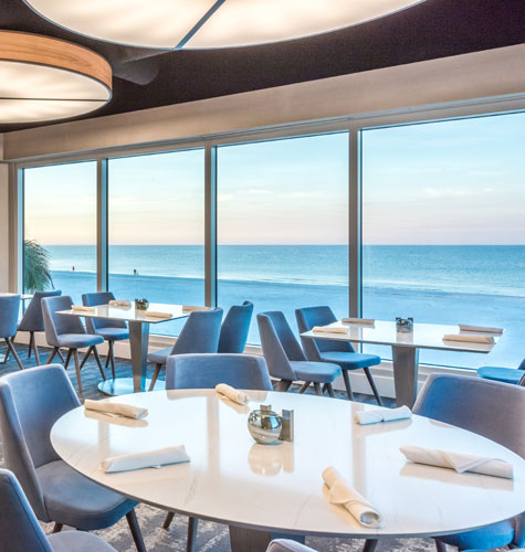 Tables at coste island cuisine overlooking the ocean