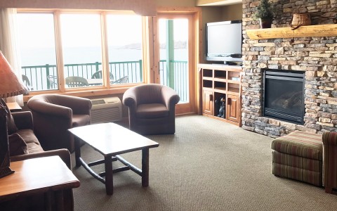cabin themed living room with fireplace