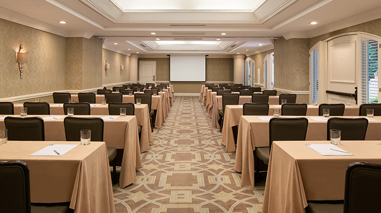large conference room filled with tables and chairs
