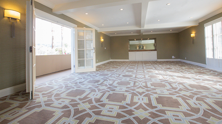 view of indoor venue with brown and white carpet