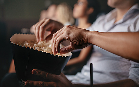 people eating popcorn