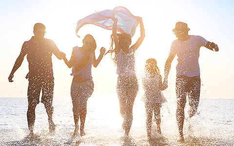 family running in sunset