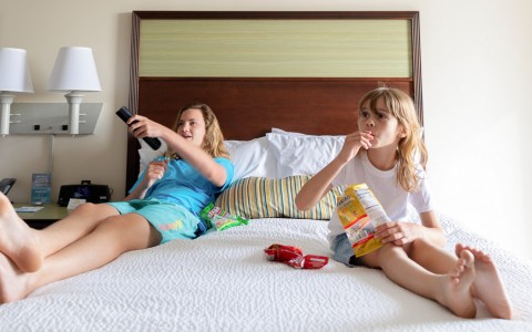 kids on bed in guest room