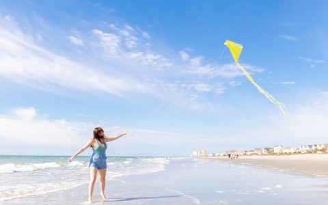 girl flying kite