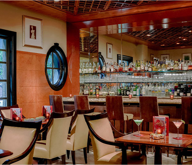 bar with chairs and wood tables