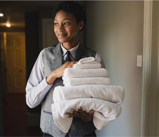 woman carrying towels