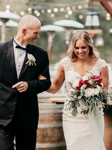 bride walking with her father down the isle outside