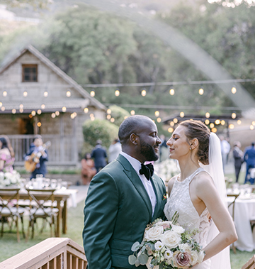 bride and groom holding each other at Stone House
