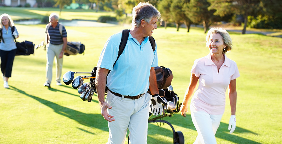 group of couples playing golf