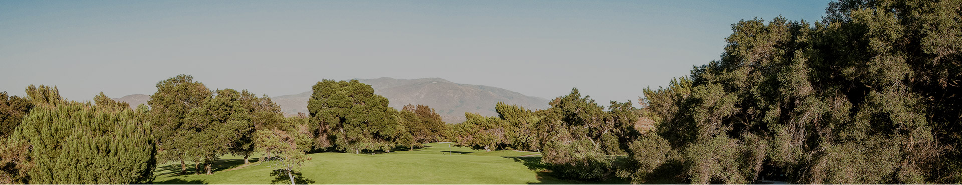 golf course with mountain backdrop