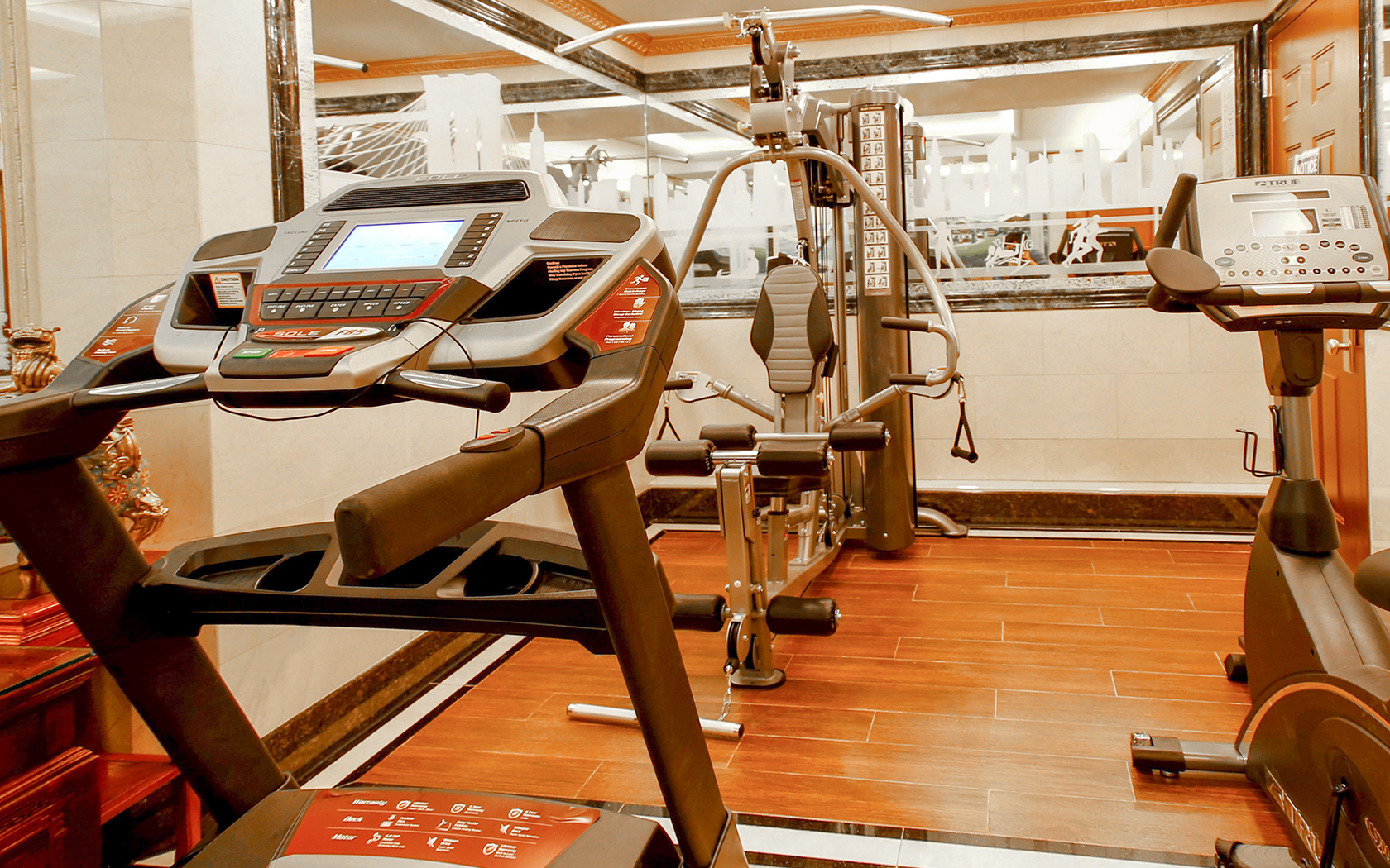 Inside hotel gym with workout equipment