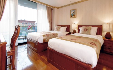 double bed hotel room with floor to celiling 