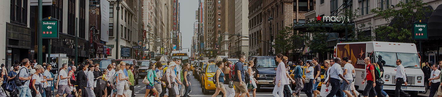 large crowd crossing a New York street