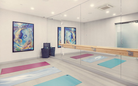 yoga room with a mirror wall