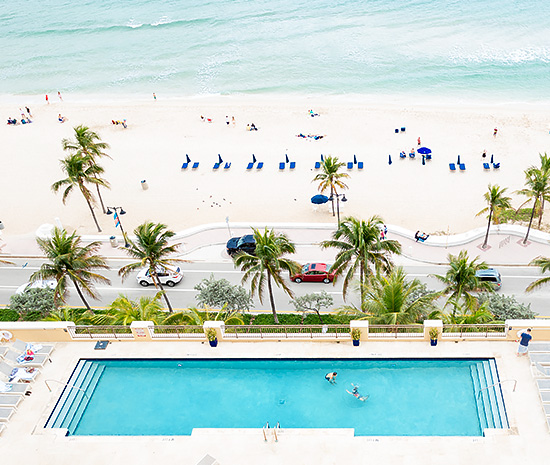 view of pool and ocean