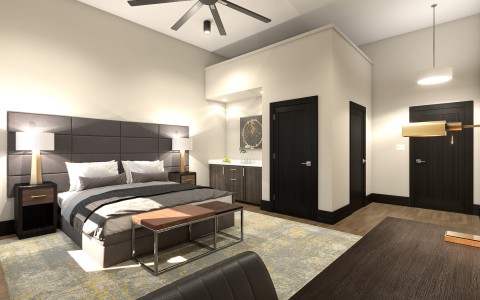 hotel bedroom with  high ceilings and a fan