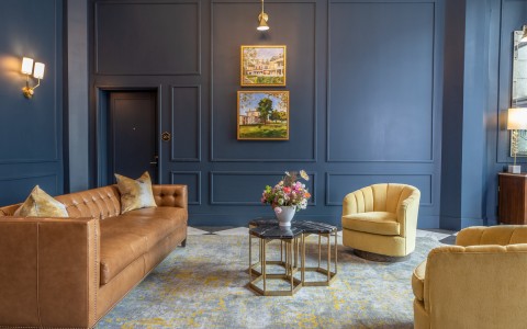 navy colored walls with yellow accents throughout