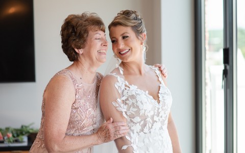 smiling bride looking at her mom
