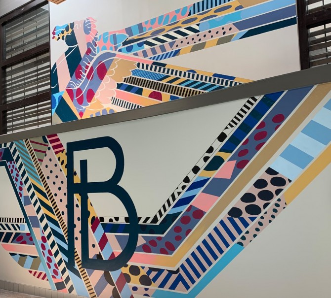 The letter B painted into a pattern on the wall