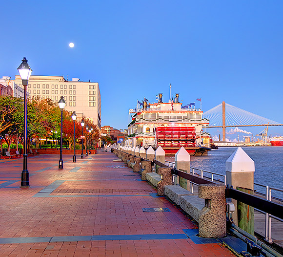 view of the boardwalk in savannah overlooking the river