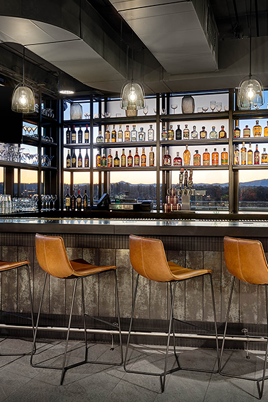 rooftop bar with city and mountain views