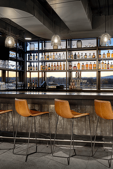 rooftop bar with city and mountain views