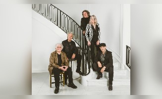 group of five people in a musician band