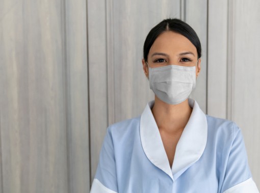 hotel housekeeper with mask