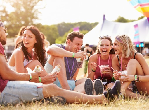people eating food in the grass