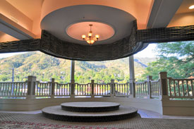 Pavilion with green mountains in the background