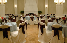 Ballroom of hotel set up with circular tables and chairs