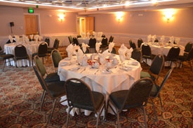 big room with large circular set dining tables and chairs