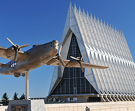 exterior of an air force building with statue of an airplane