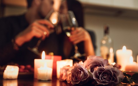 couple enjoys a romantic candlelit dinner