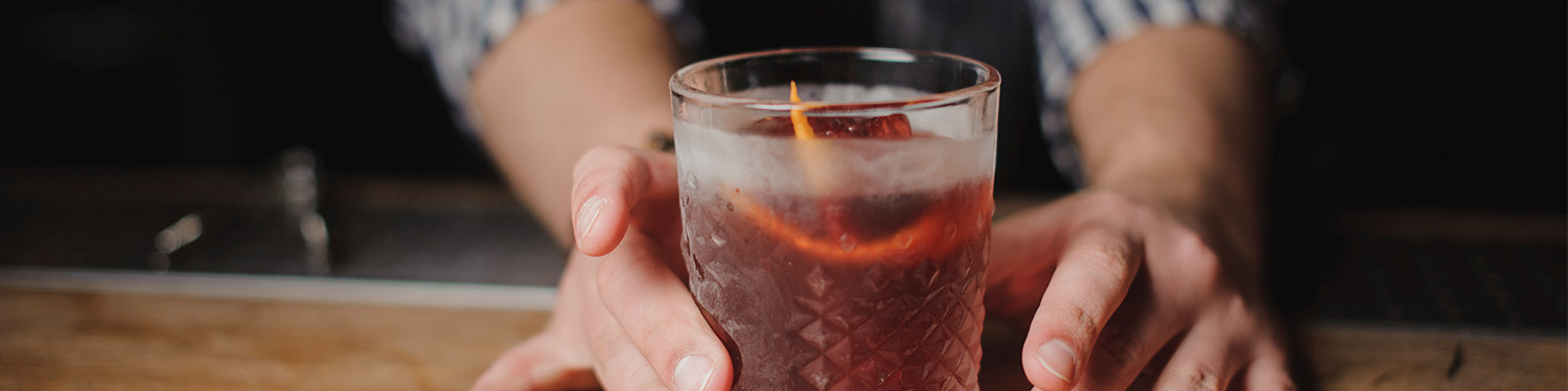 cocktail and bartender's hands