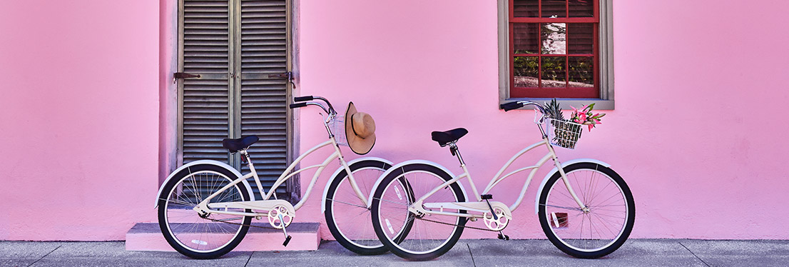 Bikes against pink wall