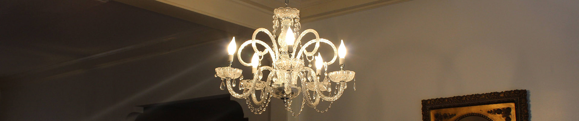 Close up of a white lighting fixture hanging from the ceiling