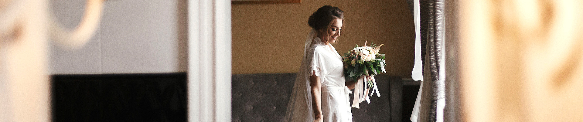 woman wearing a wedding dress holding a bouquet
