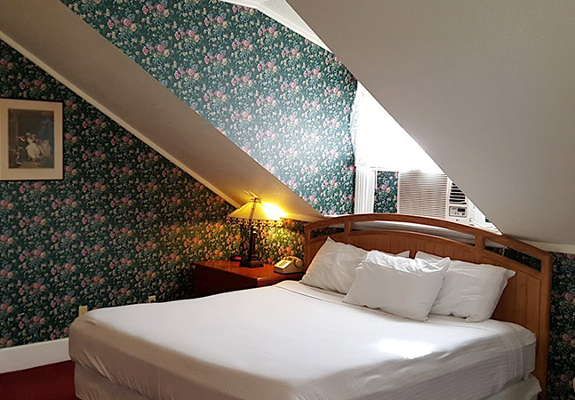 room 412 close up to the bed and window area