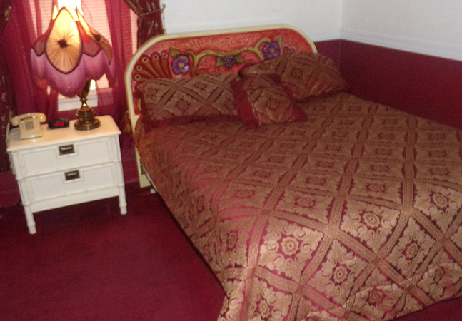 bed with red bedding
